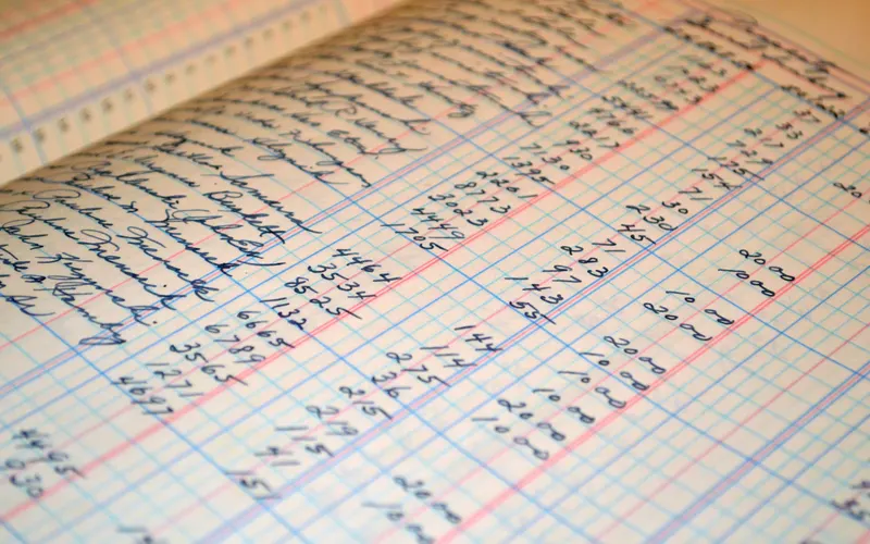 Handwritten ledger page with columns of figures in blue ink